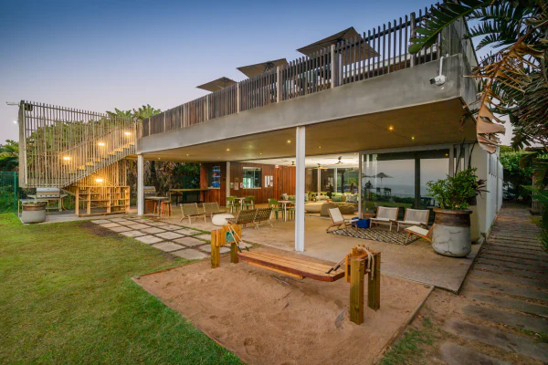 The beach clubhouse terrace and kids' play area in the evening light