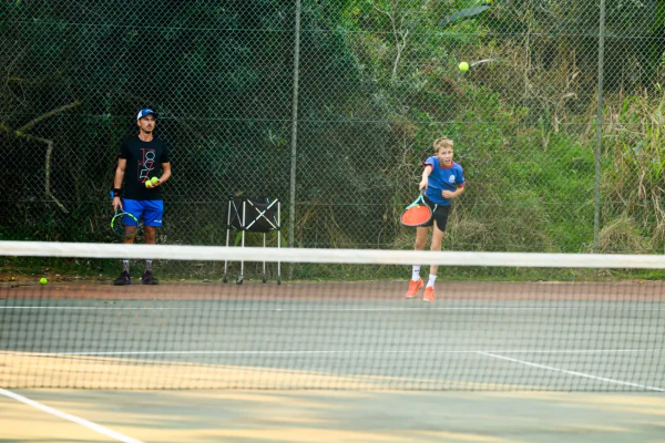 A tennis match on the estate courts