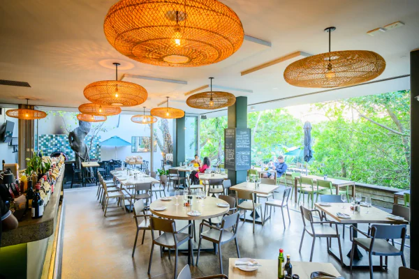 Inside Ray's Kitchen, woven pendants over the tables