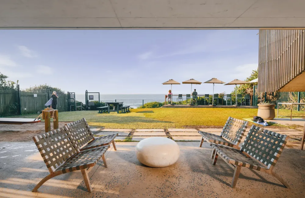 Seating in the shade of the beach clubhouse lounge